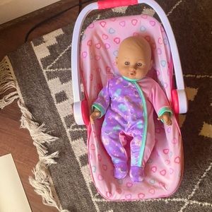 Baby doll and a baby doll carrier